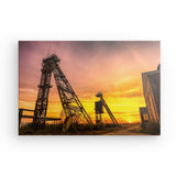 Leinwand - Stärke 4cm | Erwachende Giganten - Zwei Fördertürme im flammenden Morgenhimmel