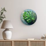 Rundes Wandbild | Grüne Stille - Monstera-Blatt vor ruhigem Farbhintergrund